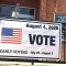 A banner outside the Clinton Township Hall invites residents to vote in the Aug. 4 primary election.